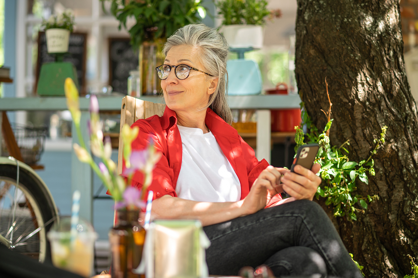 Woman on bench using mobile phone