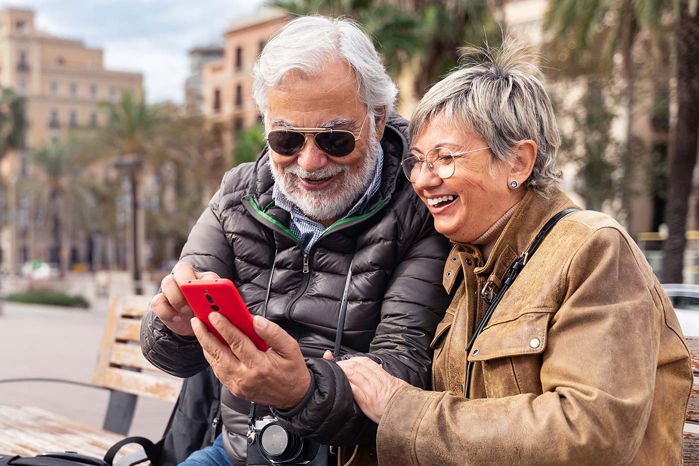 Older couple looking at a phone