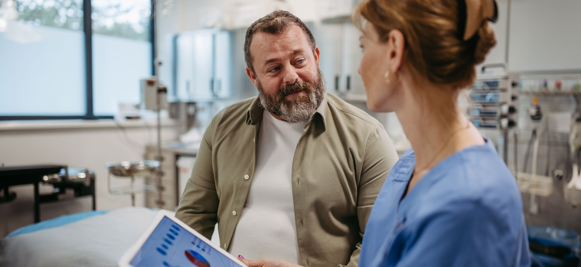 A patient discusses obesity with his physician.
