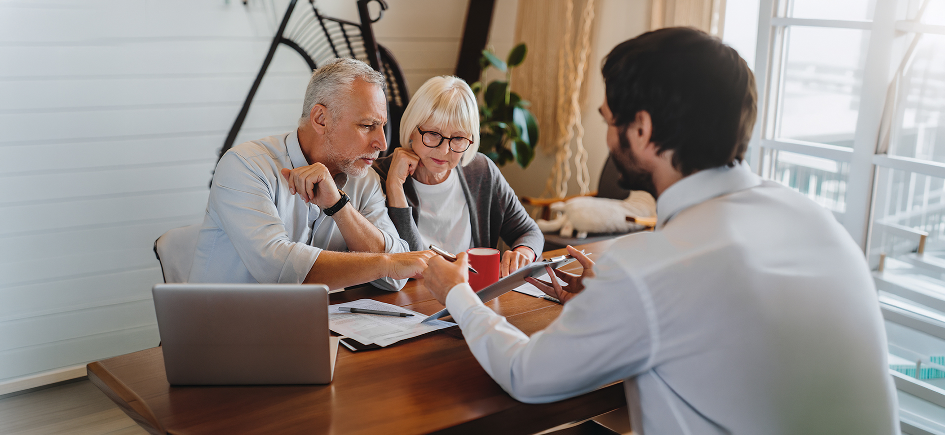 Couple discussing finances with advisor