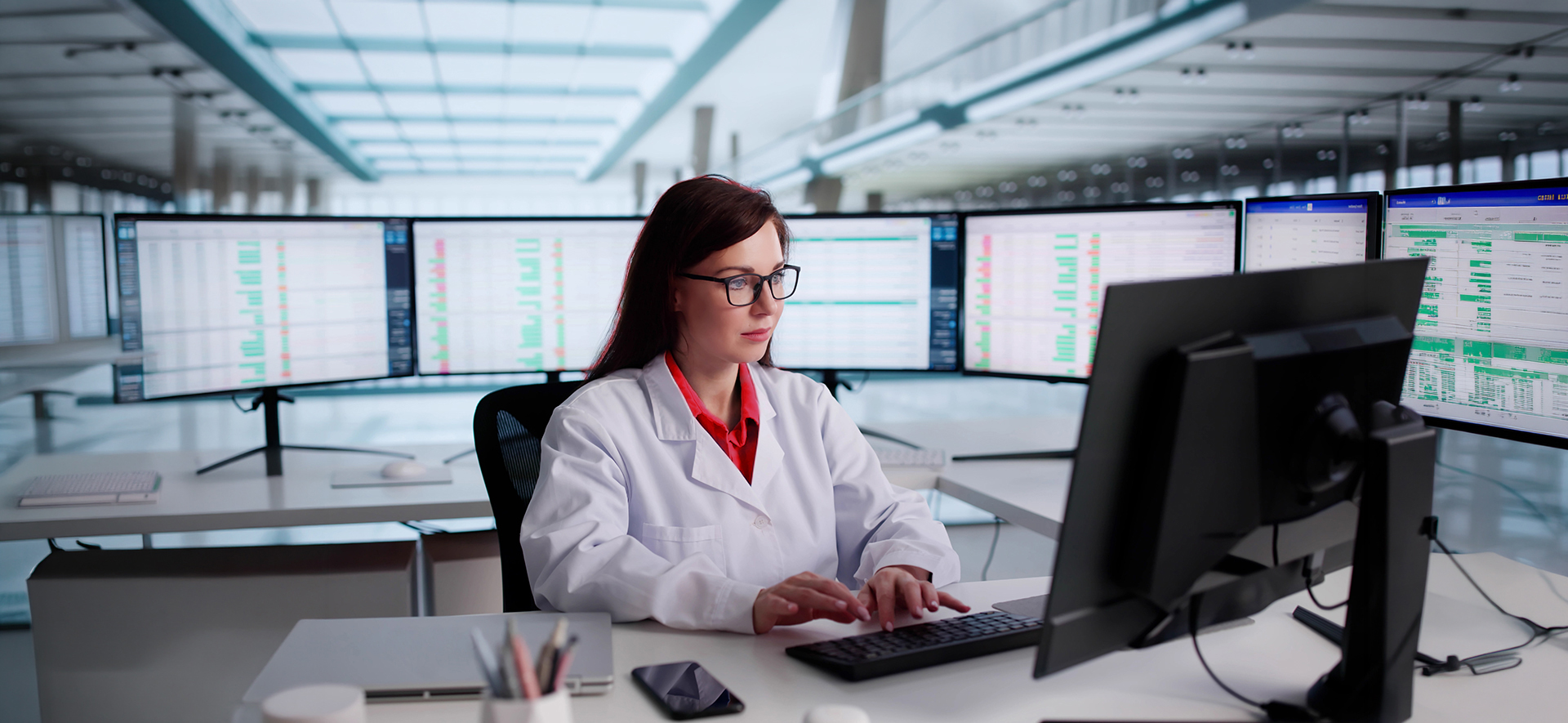 Doctor looking at data on computer monitor