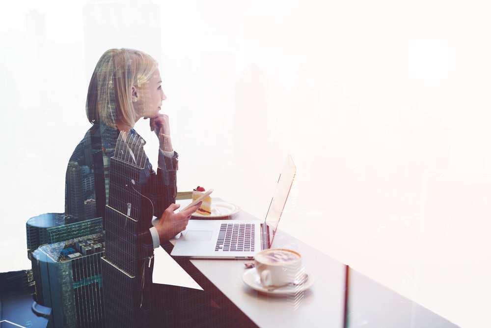 A young woman gazes in the distance, considering new opportunities