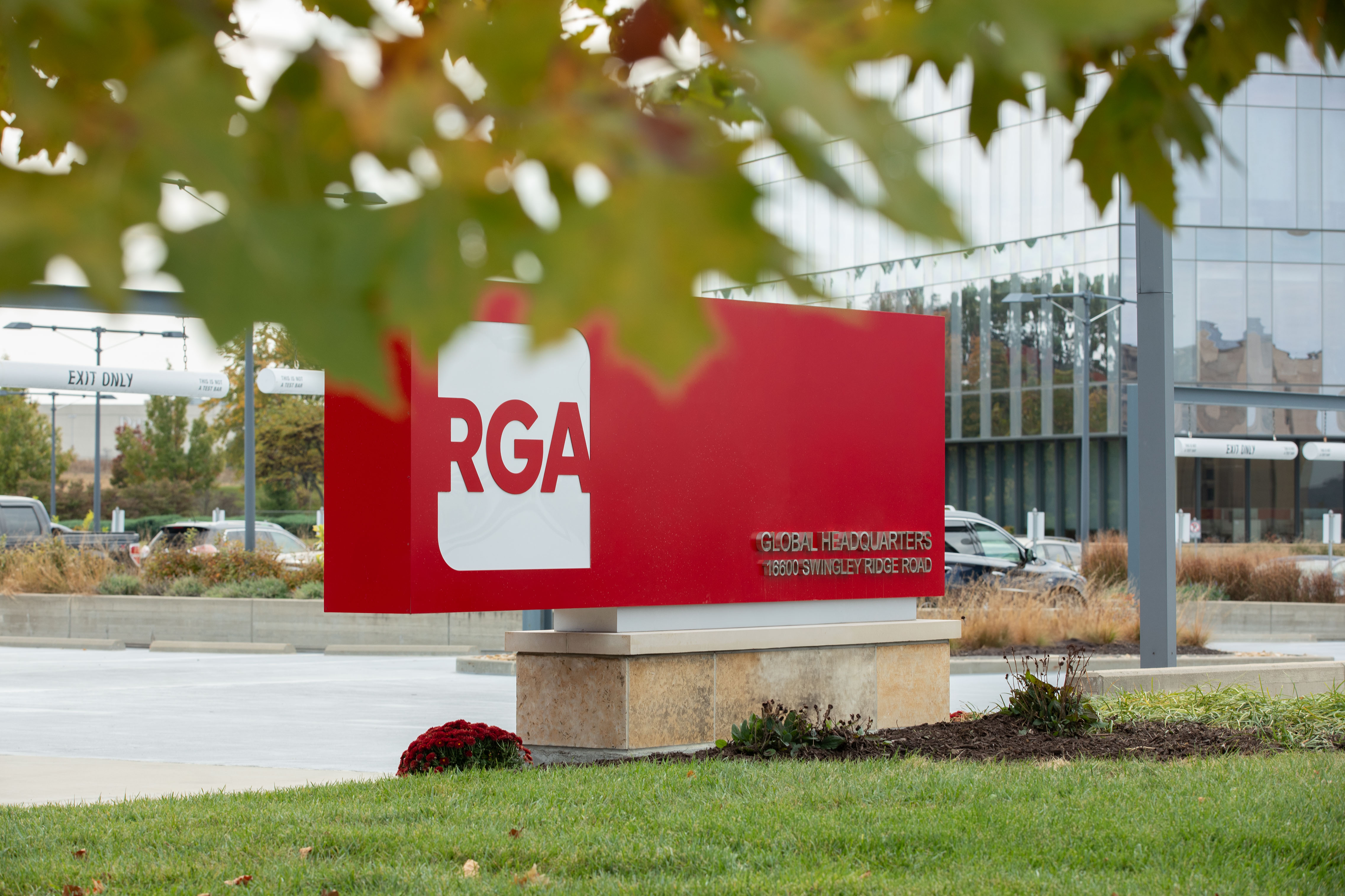 RGA Headquarters Sign with tree leafs in the foreground