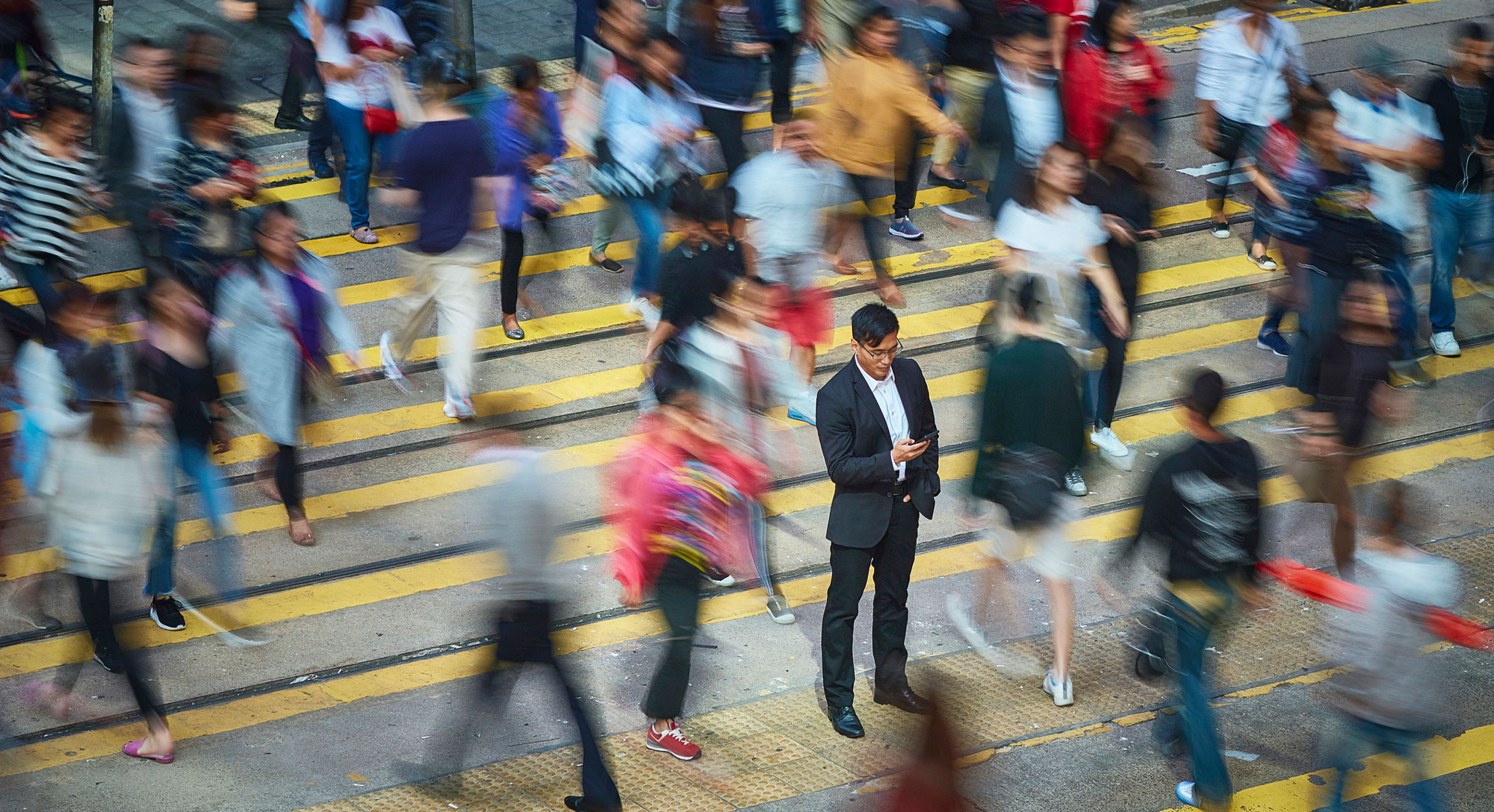 A man is pictured in a crowd, featuring individual risk assessment