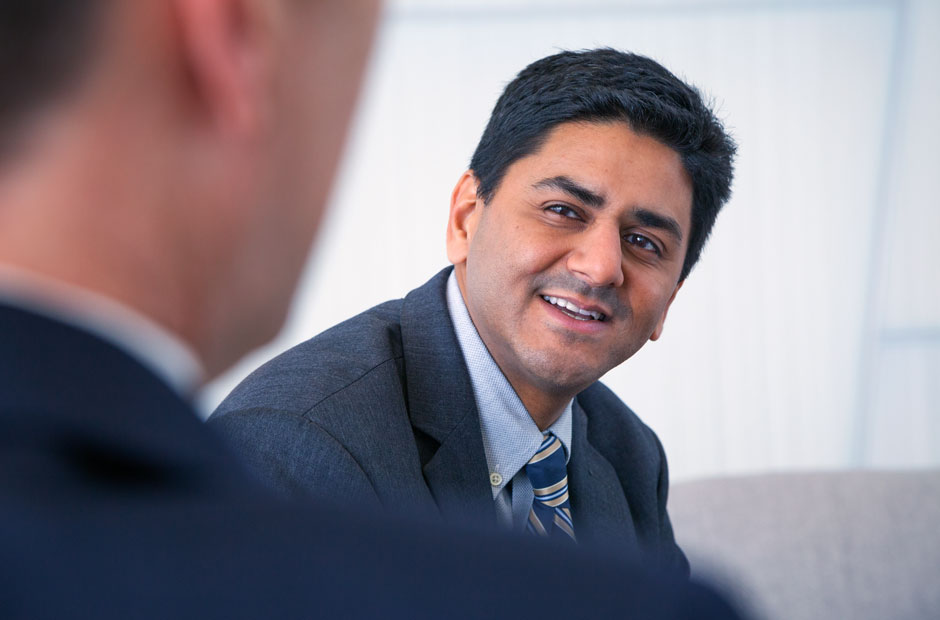 Executive leans forward in a candid conversation
