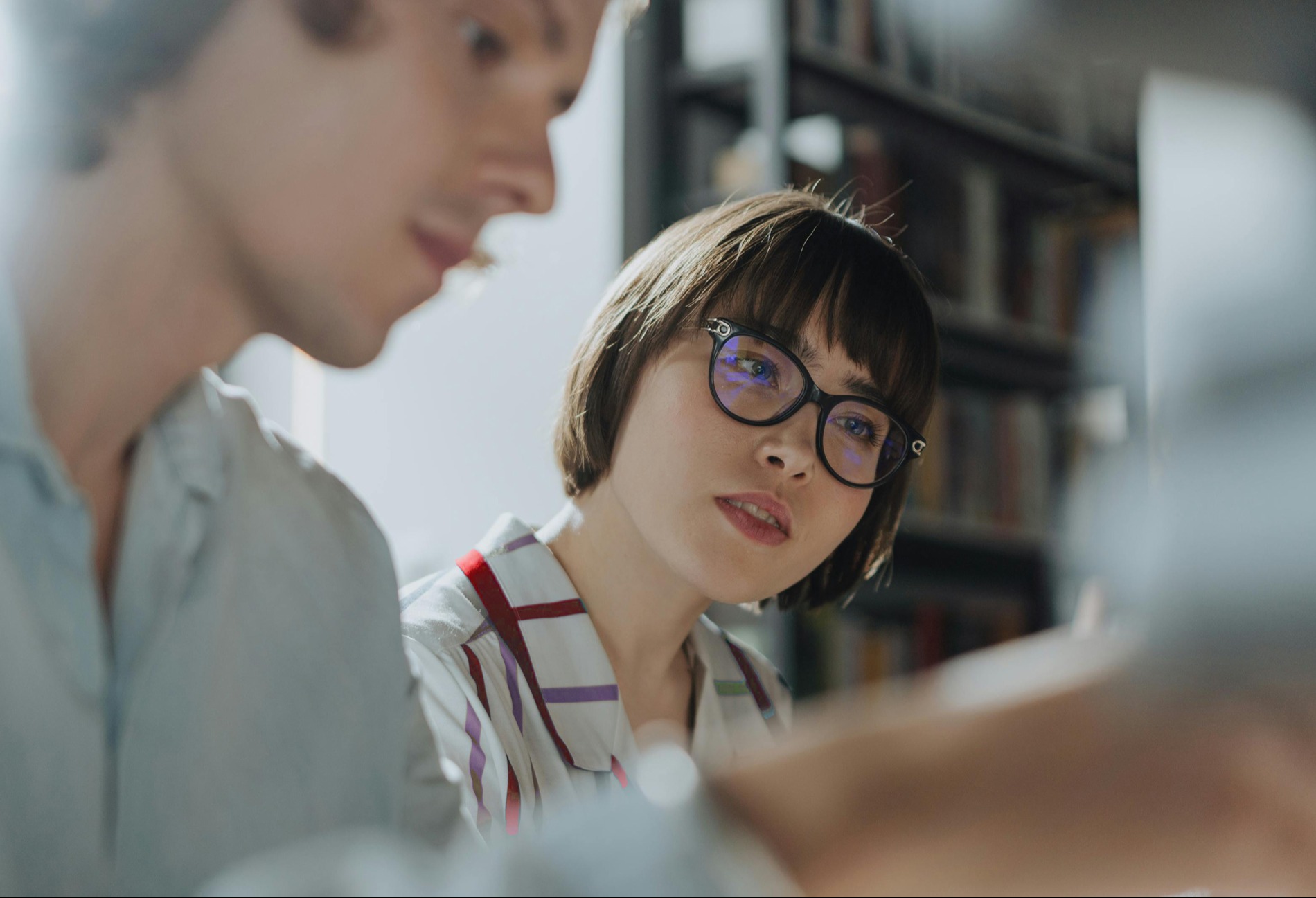 A closeup of a conversation on operational analytics between two colleagues