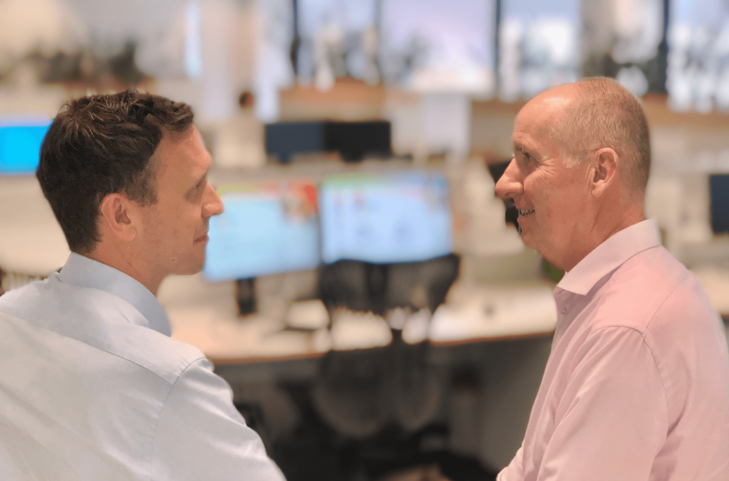 Two colleagues chat at RGA Australia's office in Sydney