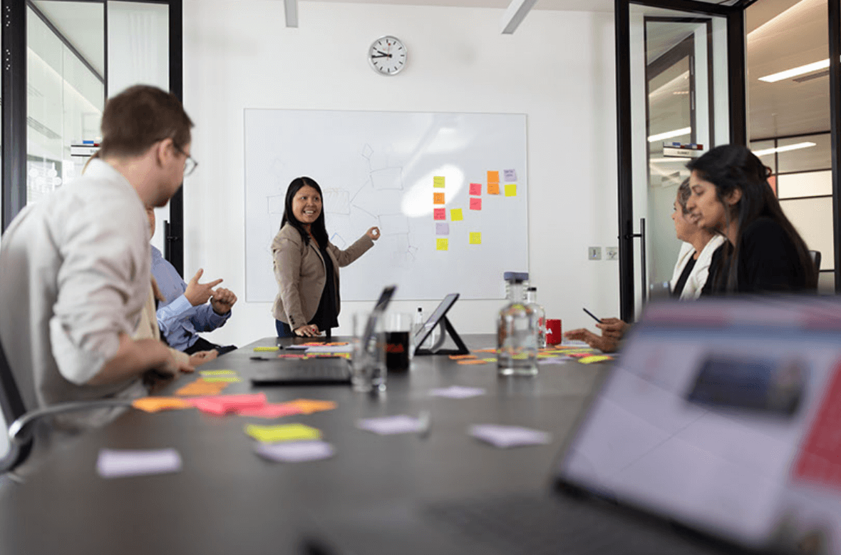 Sherlee Delos Santos, SVP of EMEA Pricing, speaks before the GFS team in the United Kingdom