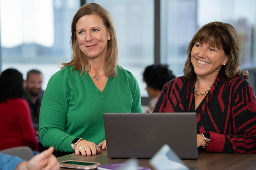 A pair of leaders from the Strategic Growth team meet.