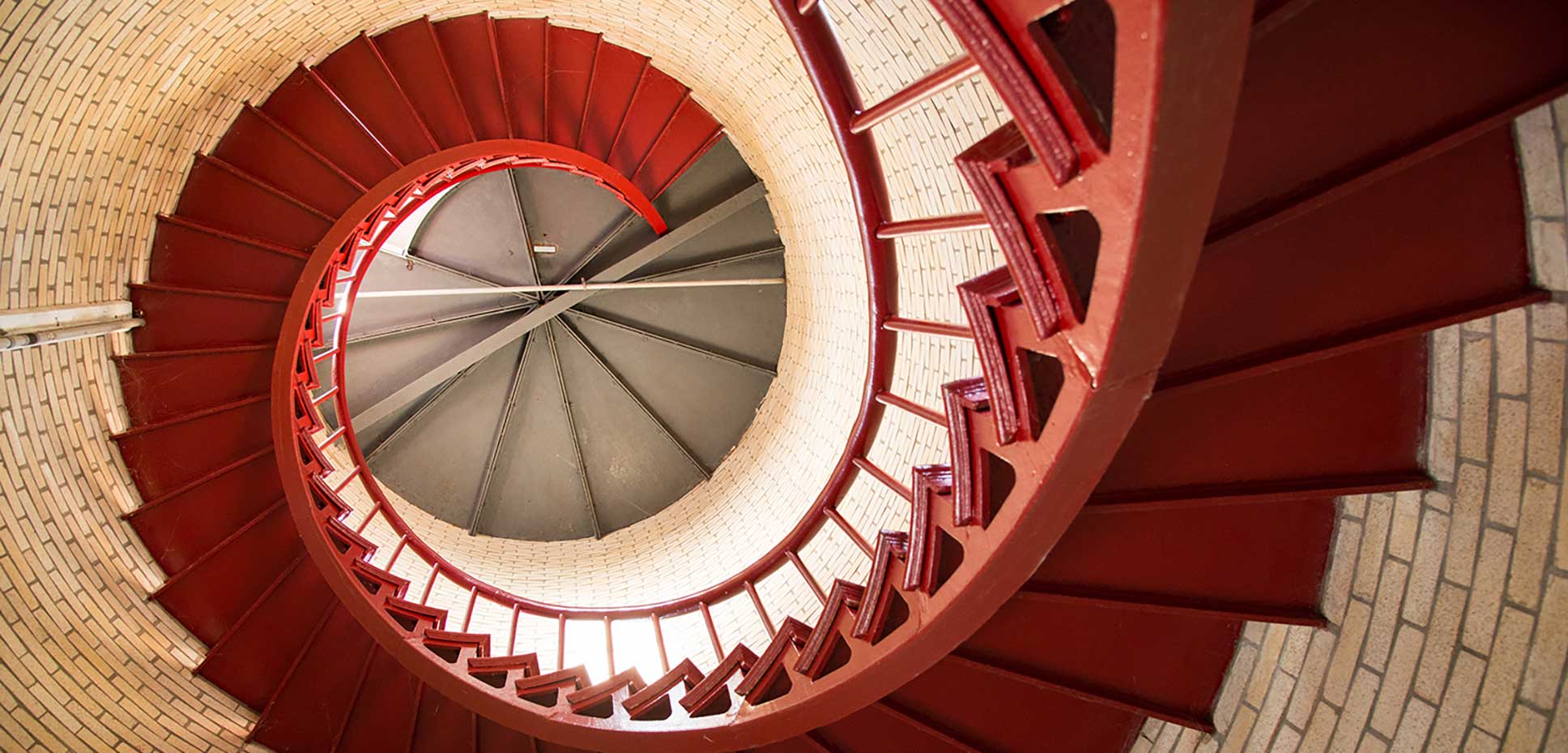 Red spiral staircase ascending