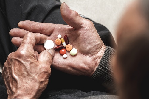 Man taking pharmaceuticals