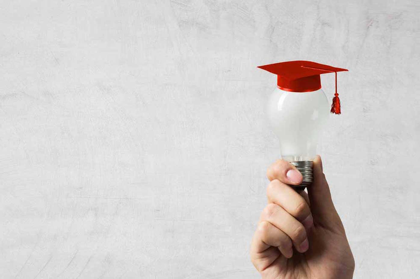 Lightbulb with graduation cap