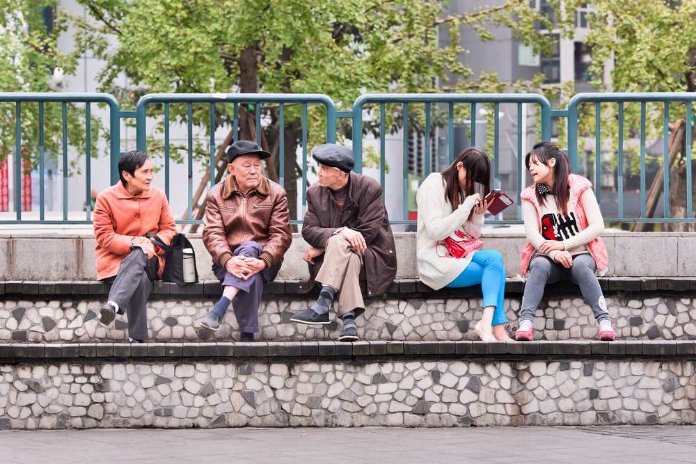 Street scene showing Asian elderly and youth