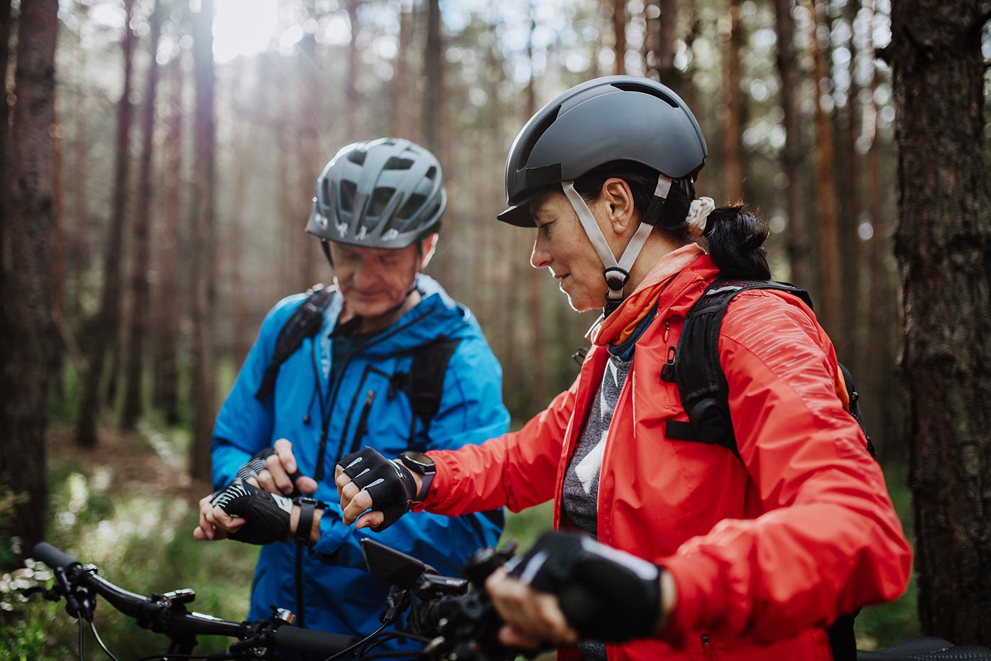Bikers setting their smartwatches