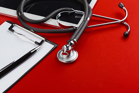 blank clipboard with modern stethoscope