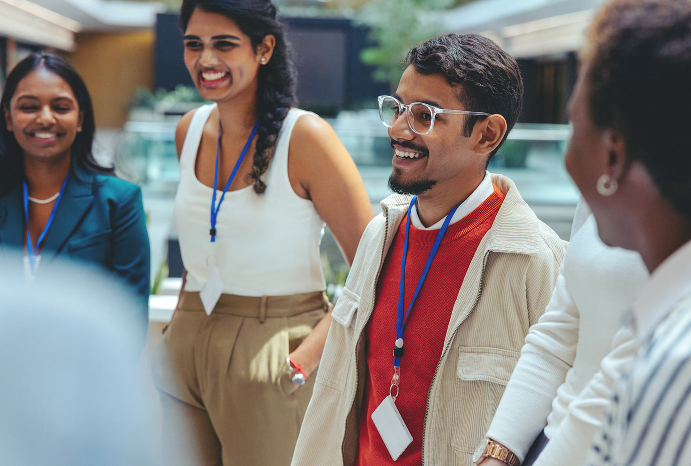 Young team of professionals laughing