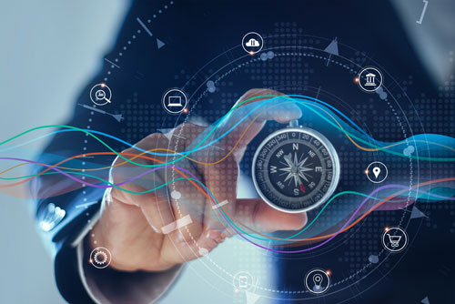 Image of compass held in the hand with light streaks and data superimposed