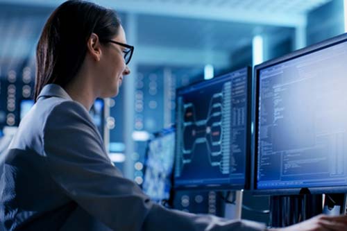 Woman working in a data monitoring center