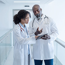 Doctors in lab coats Consulting