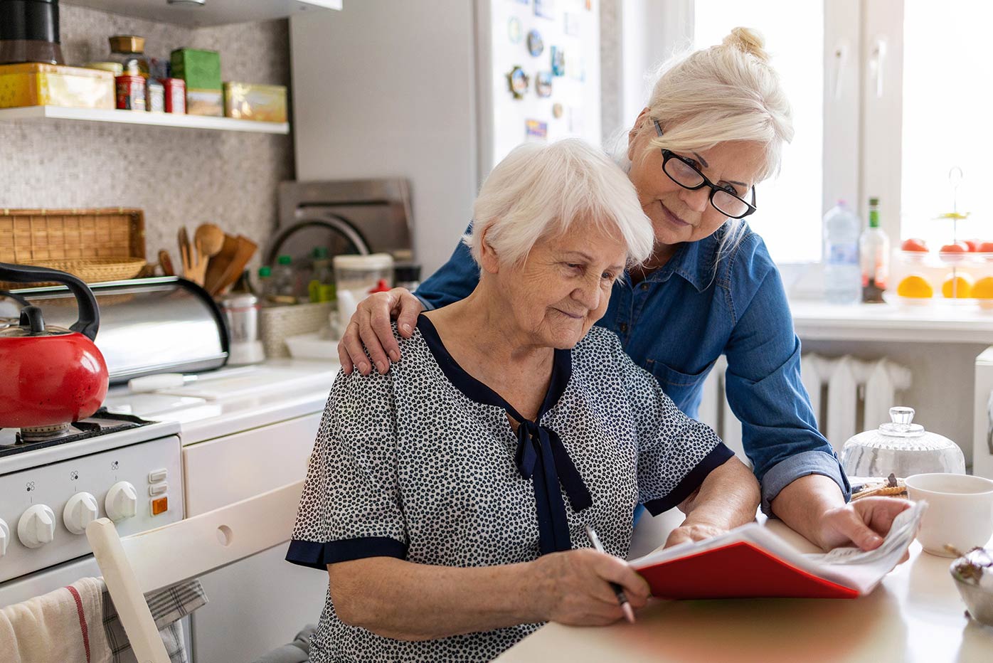 Elderly care for woman in the kitchen