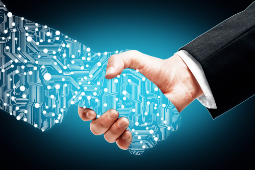 Handshake with digital hand representing marriage of artificial intelligence and human intelligence