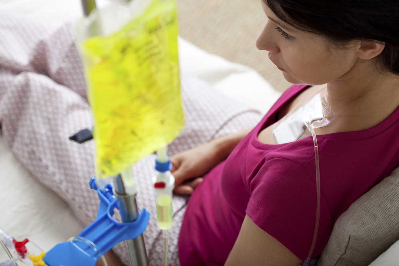A patient reclines as she receives chemotherapy to treat cancer