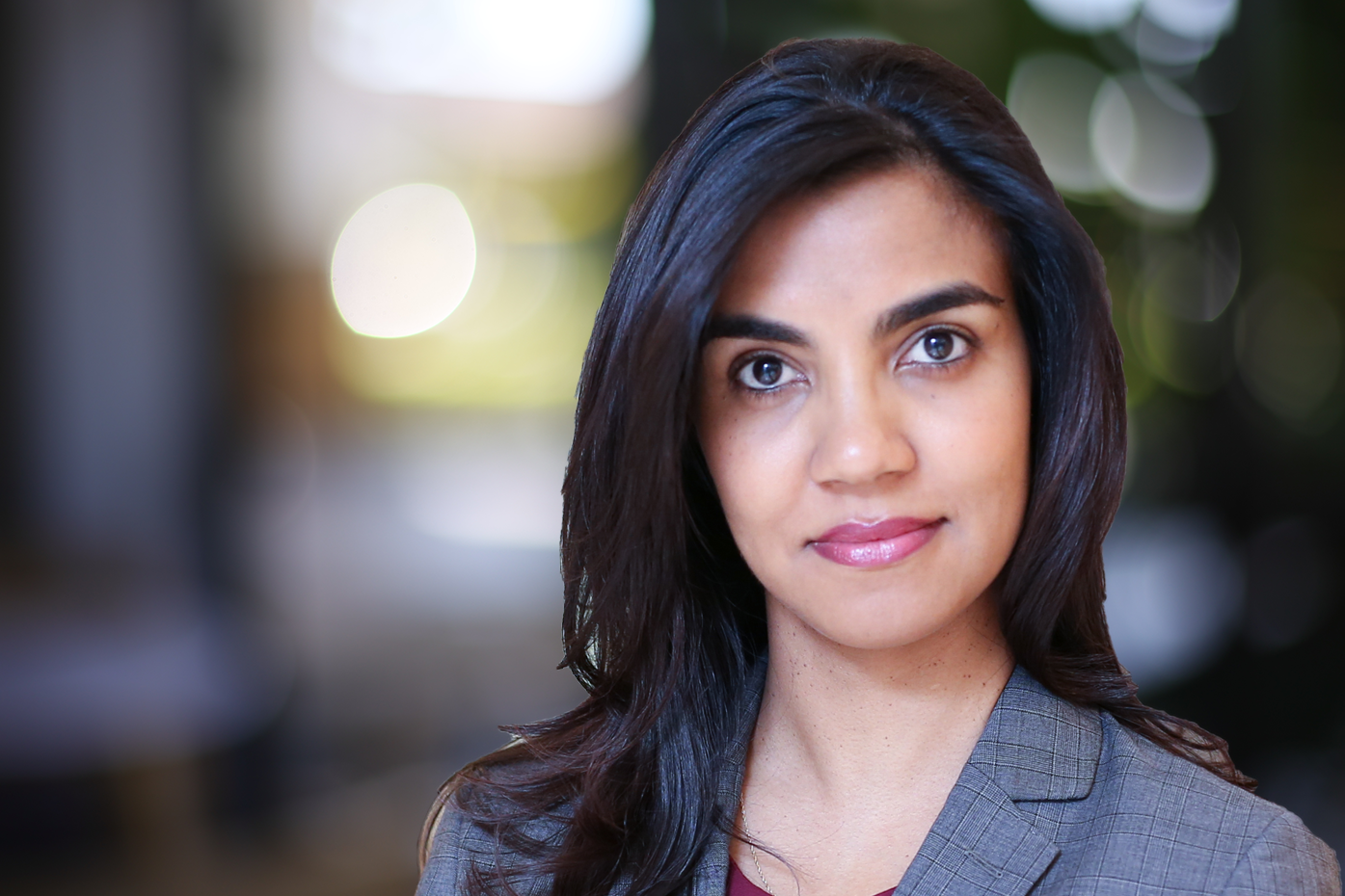 Profile of businesswoman with multicolored boteh background