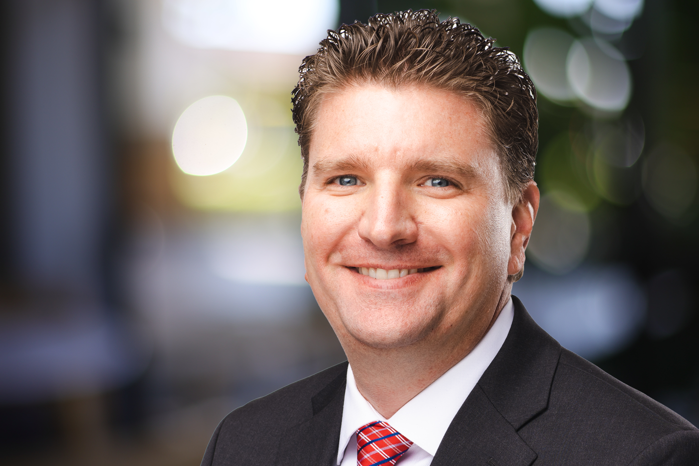Profile of businessman with multicolored boteh background