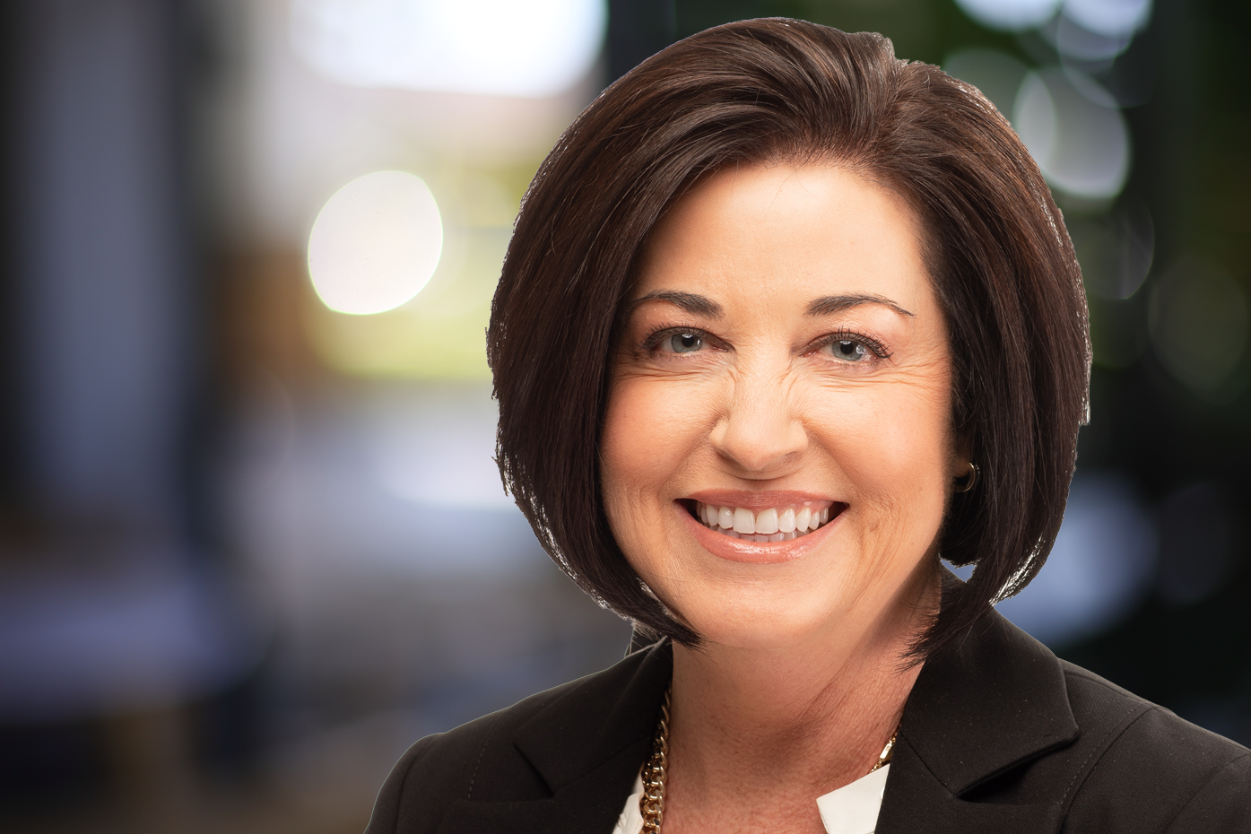 Profile of businesswoman with multicolored boteh background