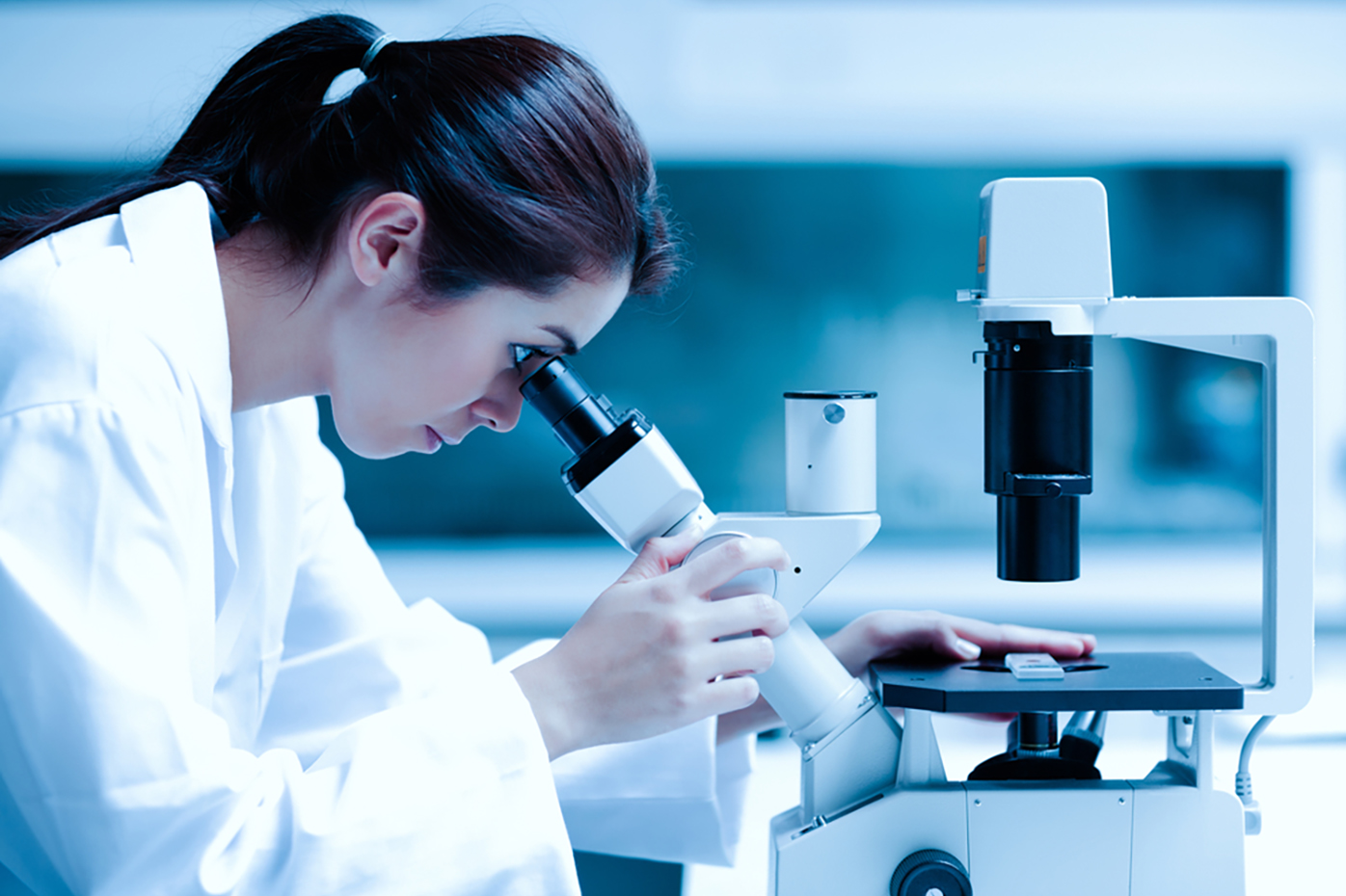 Image of woman at a microscope