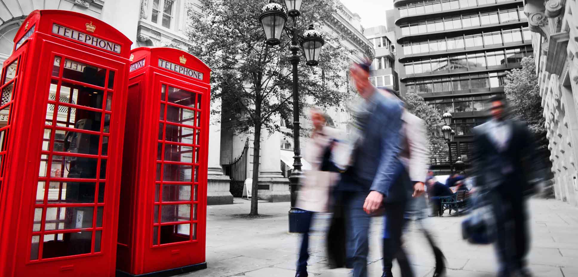 Shot of busy London street with two phone booths
