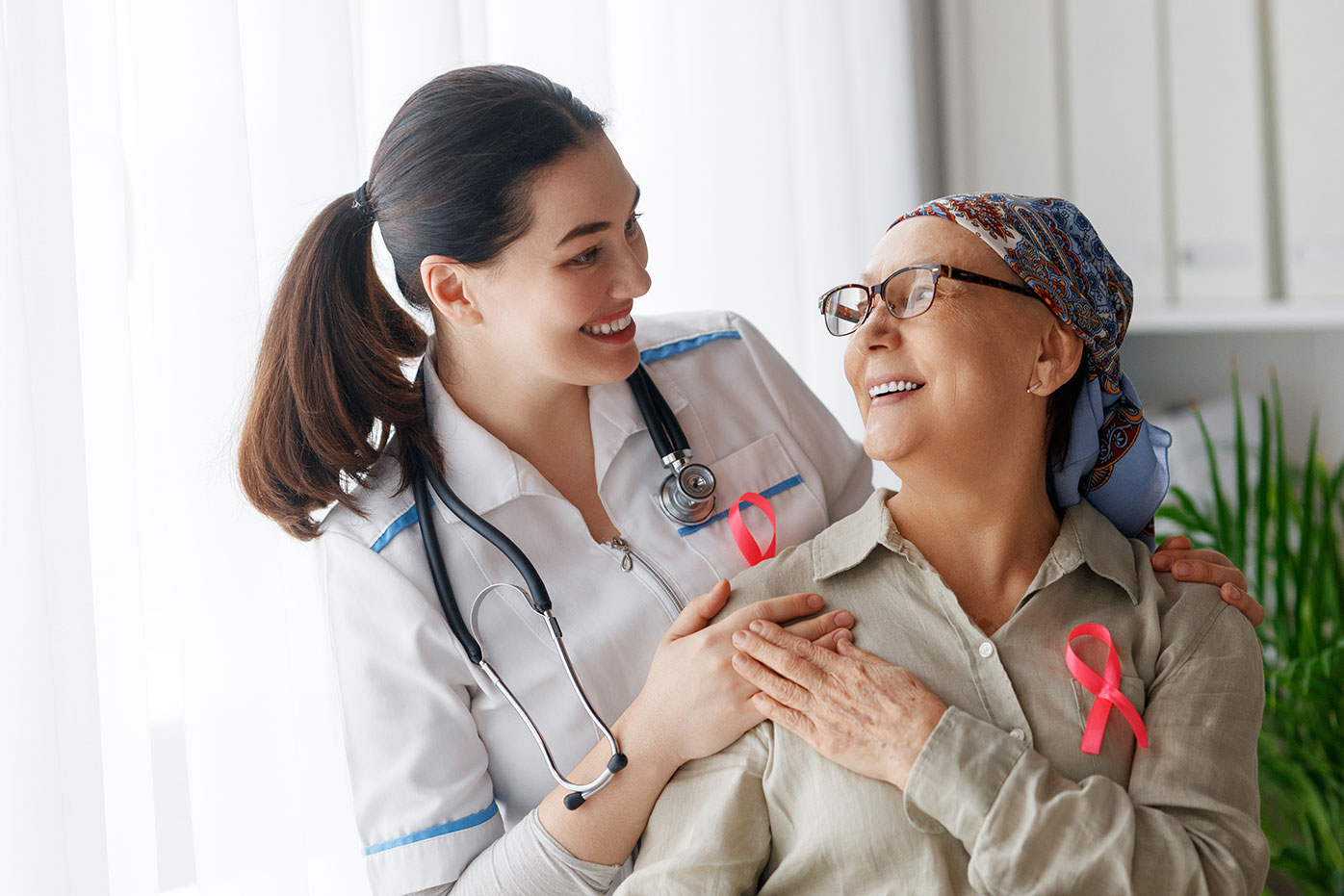 Elderly woman getting care from a nurse