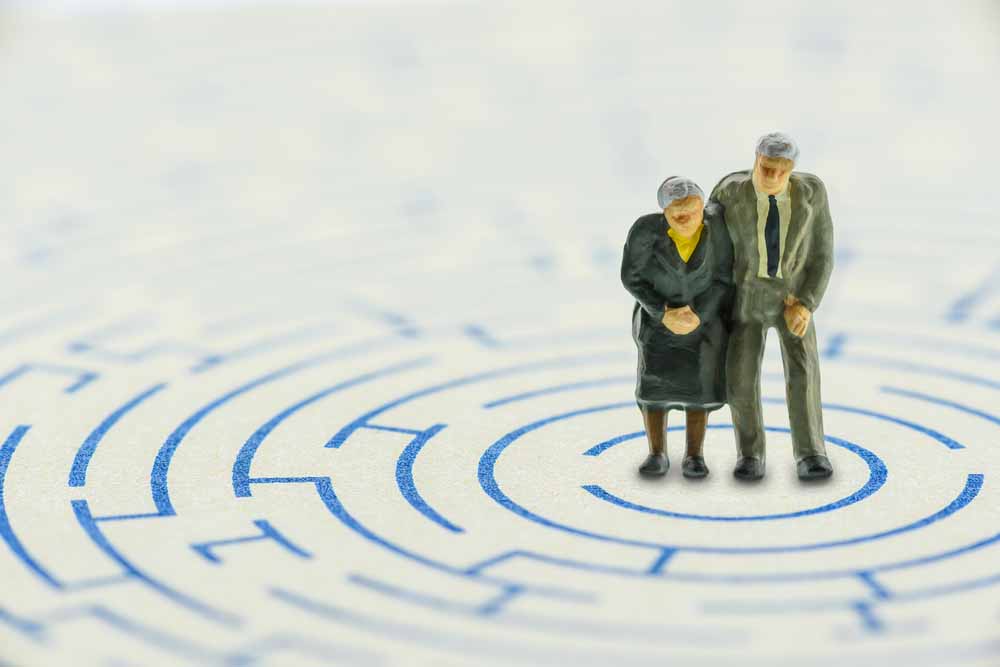 elderly figures at center of radiating maze