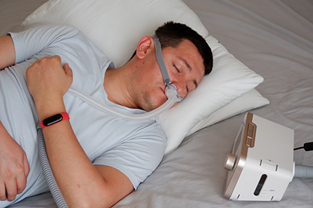 Man asleep wearing mask