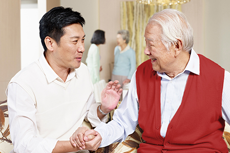 Middle aged man with elderly man