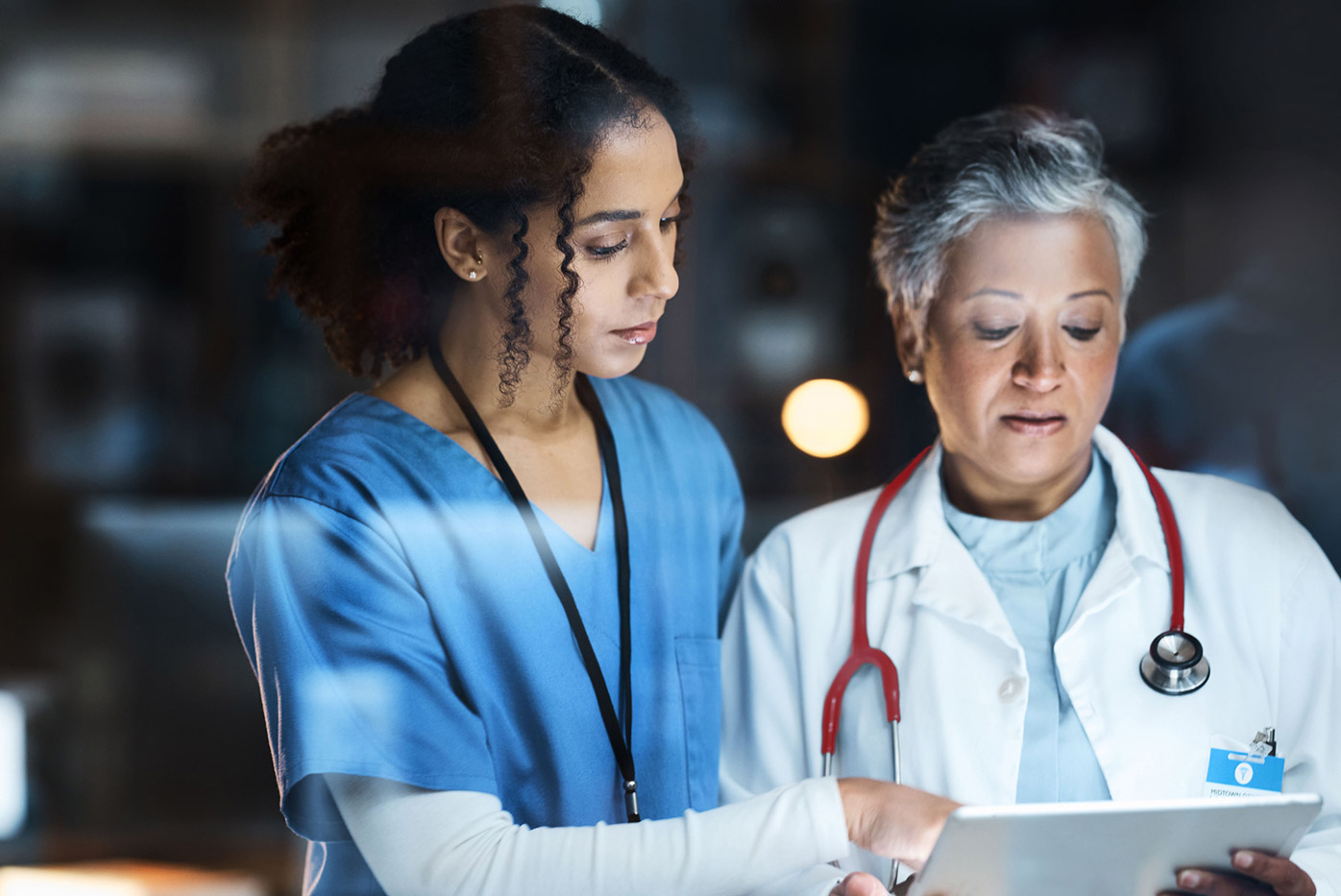 Nurse and doctor looking at chart