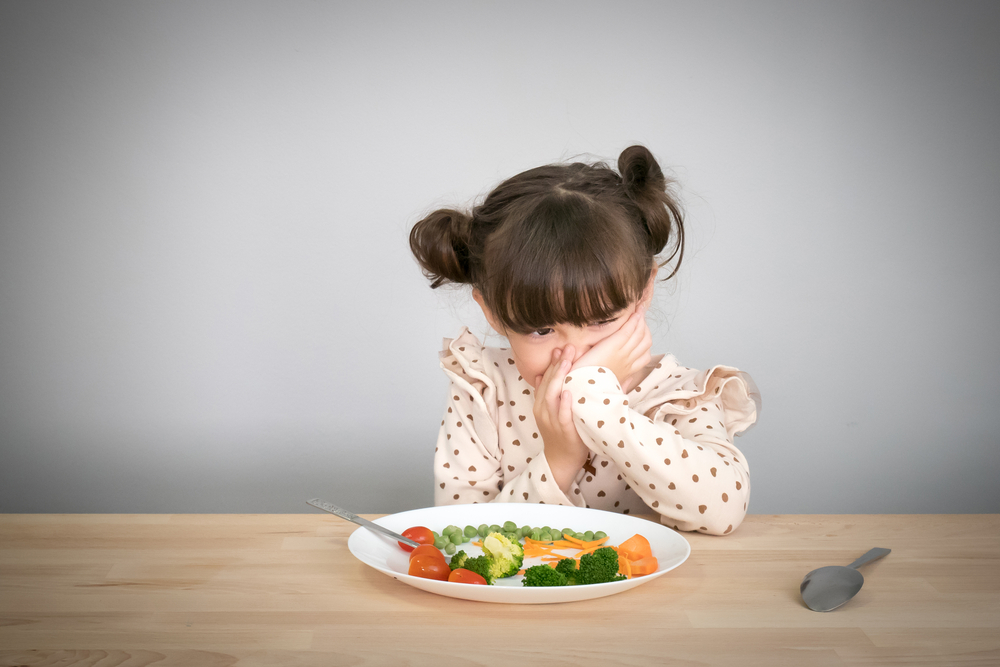 Child turning down vegetables