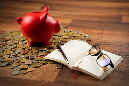 piggy bank and notebook