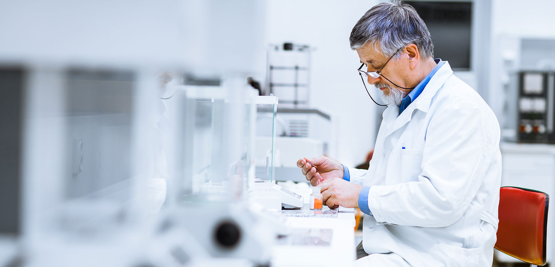 Man in lab coat working in a medical laboratory