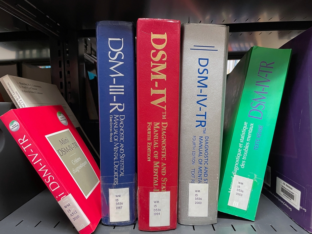 DSM manuals line a shelf