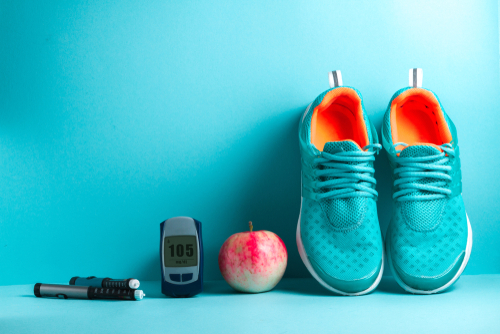 Well controlled diabetes: diabetic management tools monitor, apple and shoes