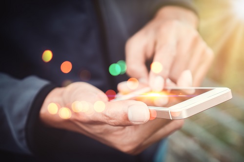 Man manipulating a smartphone