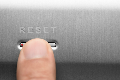 Finger tapping the reset button