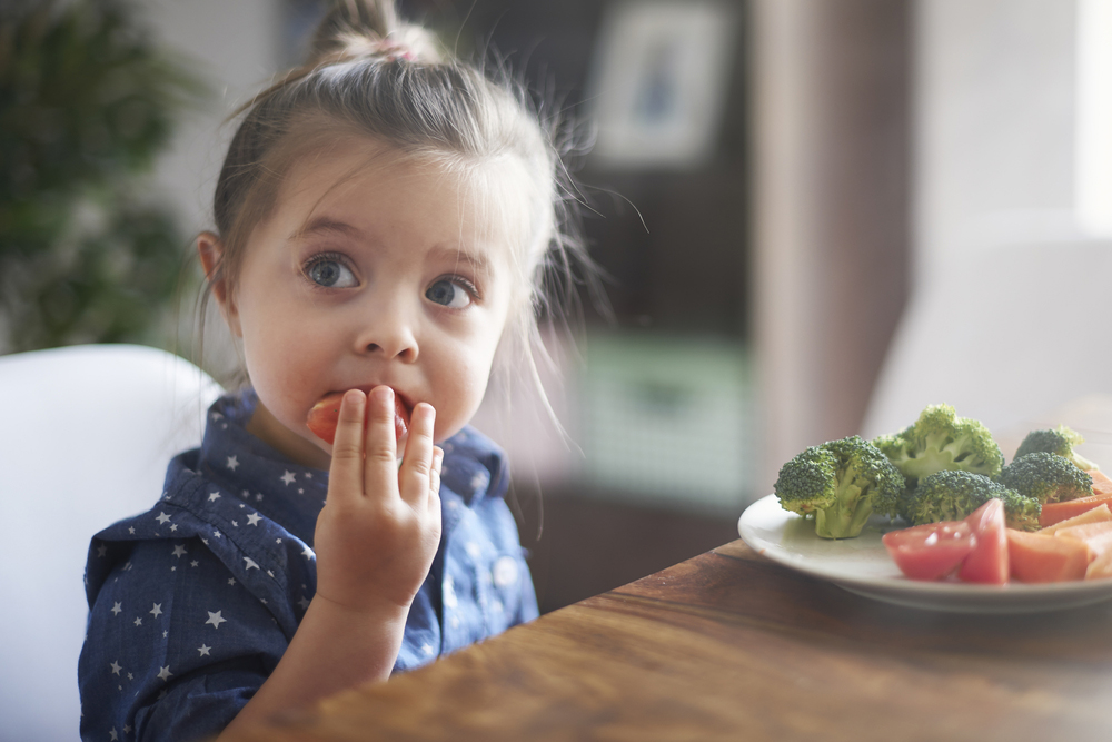 Child eating vegetables and consumer engagement