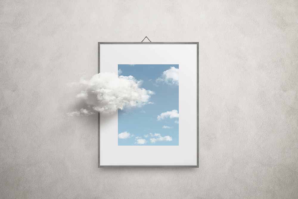 Illustration of frame with clouds floating outside