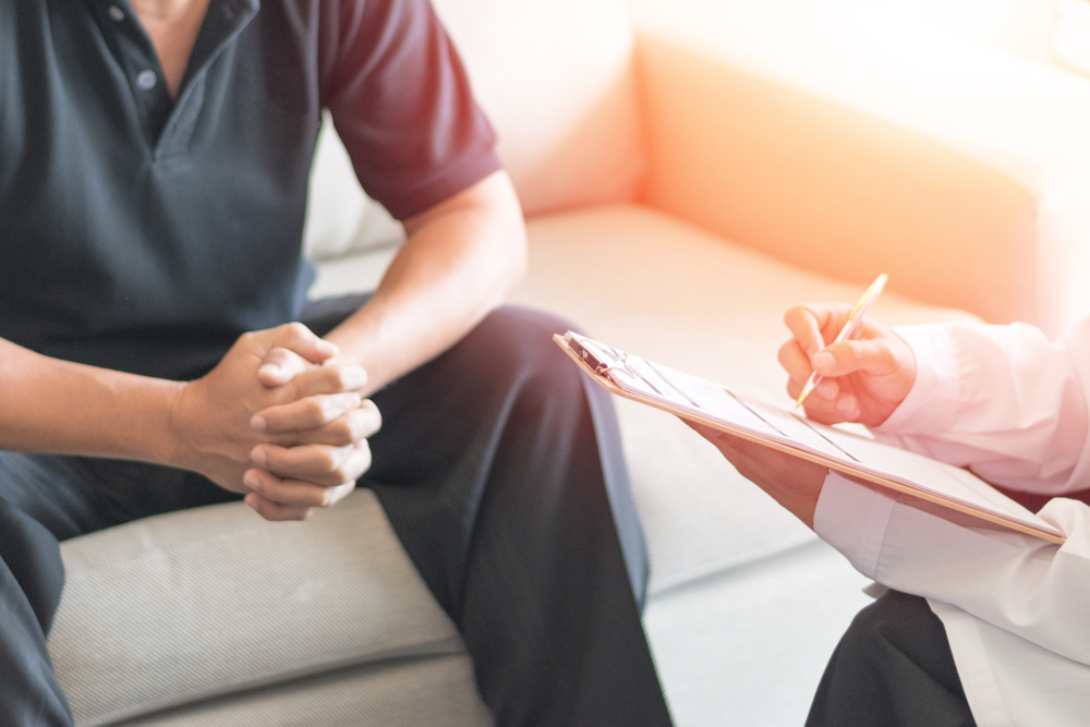 Doctor consulting with patient