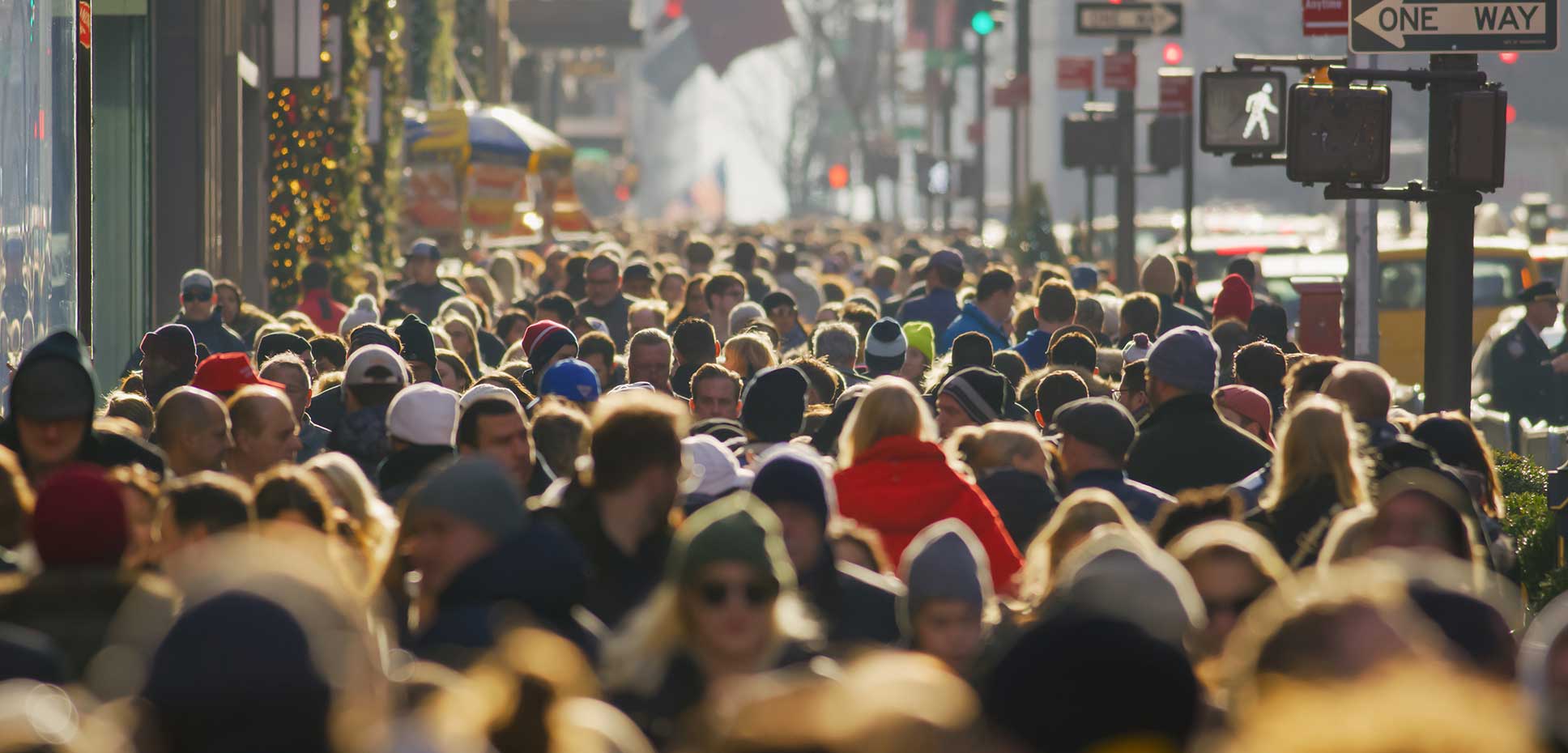 Aerial shot of large crowd on a city sidewalk