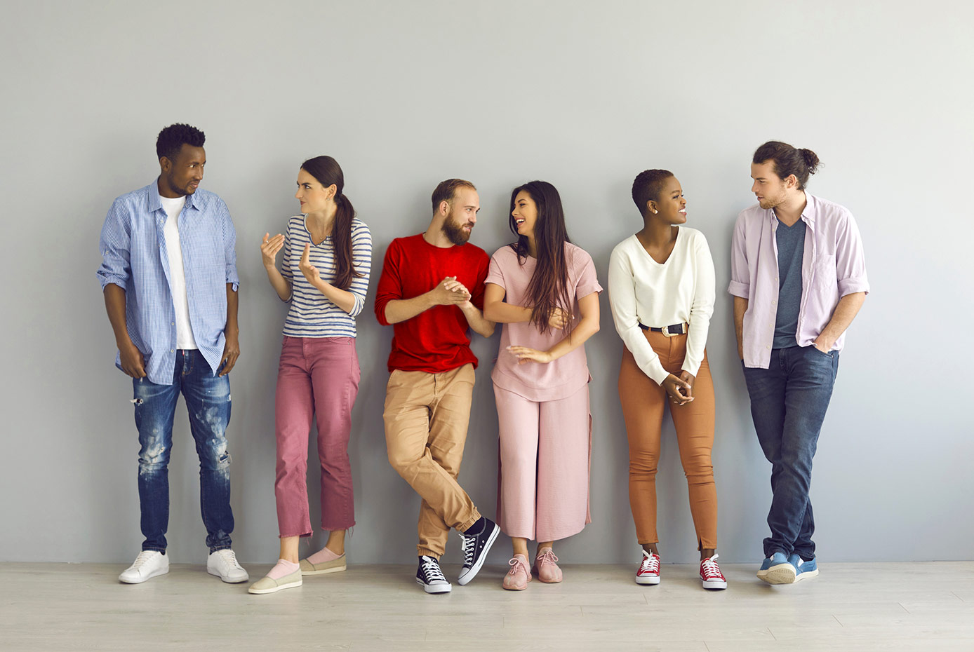 Six people standing and talking