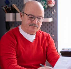 A claims analyst looks grimly at a stack of forms