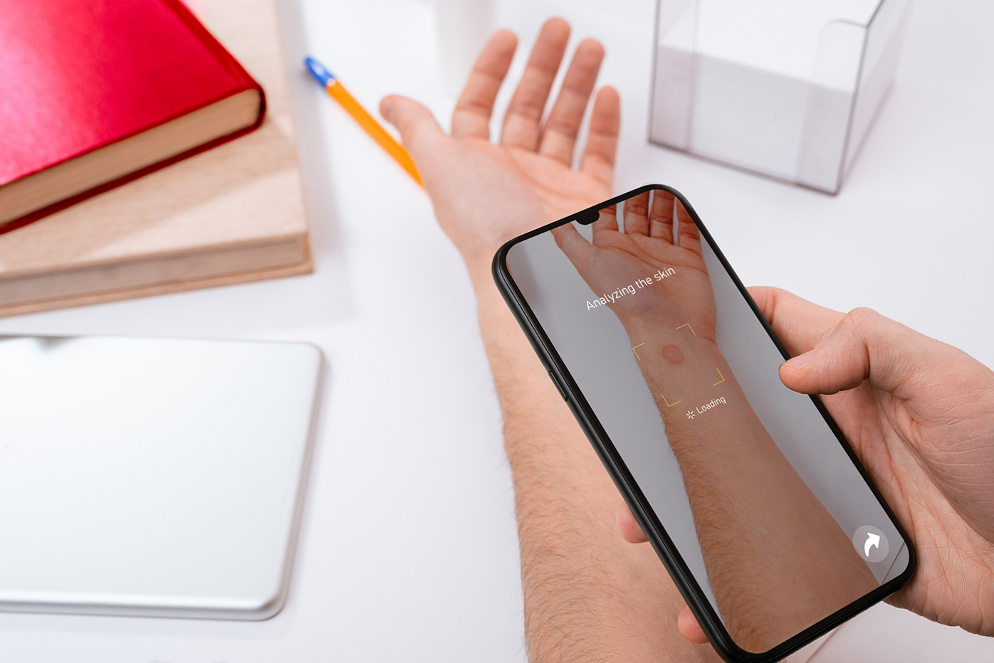 Using a phone to take an image of a wound on an arm
